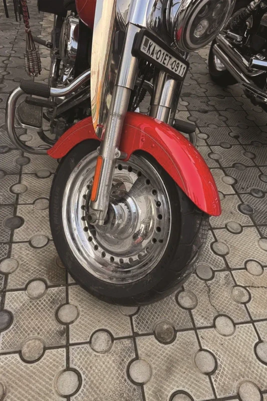 Front close view of Harley-Davidson Fat Boy 103 fitted with premium Michelin cruiser tyres fitment 3
