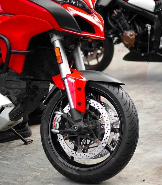 Pirelli Angel GT II front tyre fitted on a red sport motorcycle