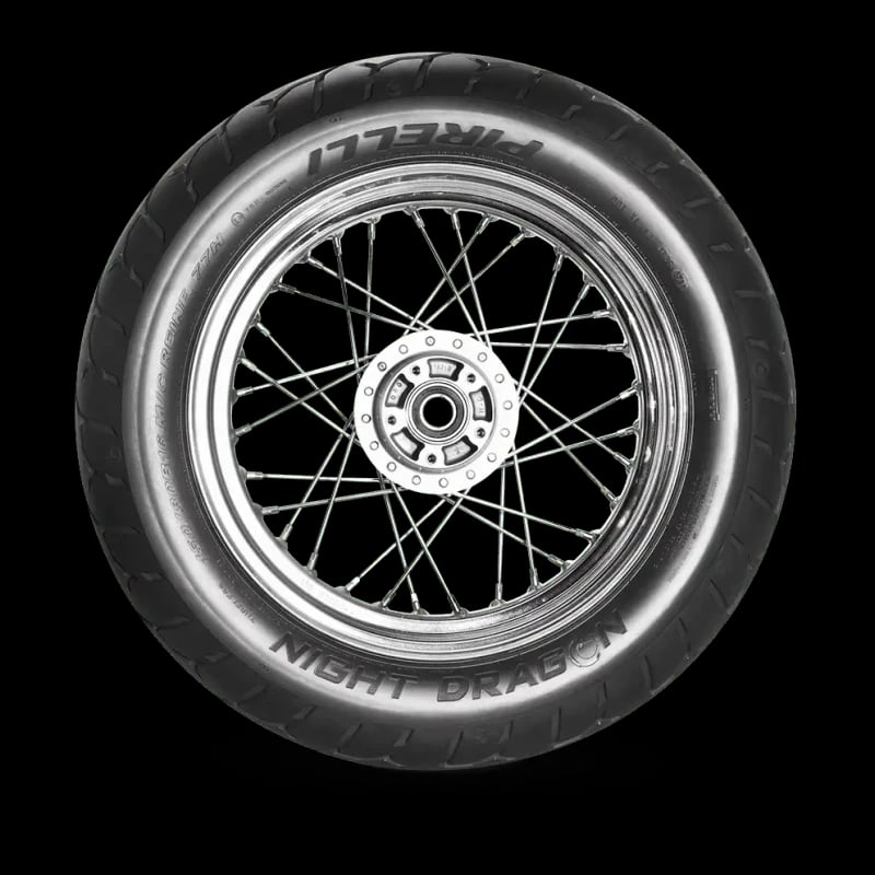 Pirelli Night Dragon tyre mounted on a wire-spoke motorcycle wheel