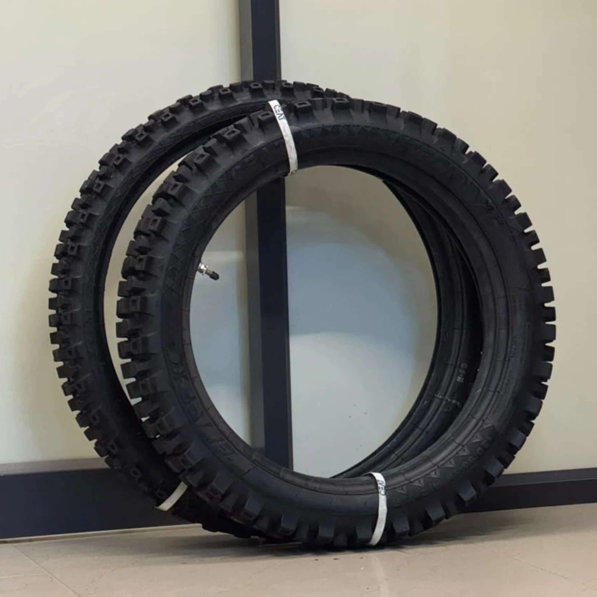 CEAT GRIPP XC F Tyres Side Profile View Side profile of CEAT GRIPP XC F 90/90-21 front and 120/90-18 rear tyres showing the tyre shape and tread blocks